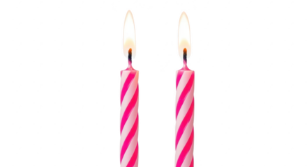 Two bright pink striped birthday candles burning with a flame
