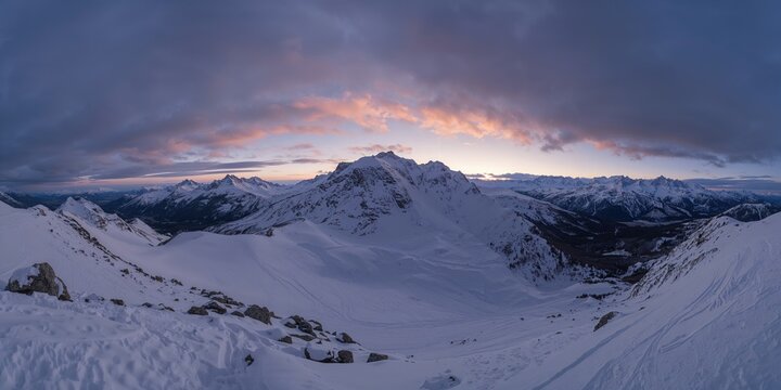 Sunset over snowy mountain landscape in Sedrun, ideal for travel and outdoor activities, winter season