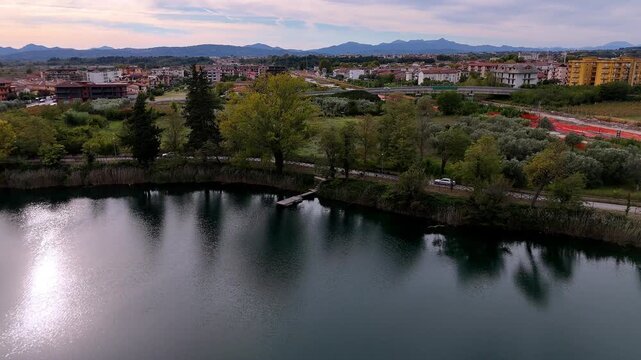 Lago Telese Drone Flight at Winter Sunset Over Calm Waters in Campania, Italy