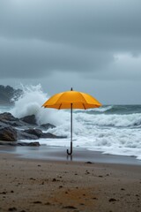 Yellow Umbrella on Stormy Beach