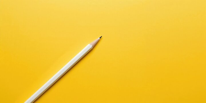 Diagonal white sharp wooden pencil on a bright yellow background, suitable for layout design or text overlay, World Creativity Day