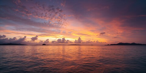 Fototapeta premium Sunset sky with clouds over the sea in Phuket, Thailand, ideal for background design or editorial layouts