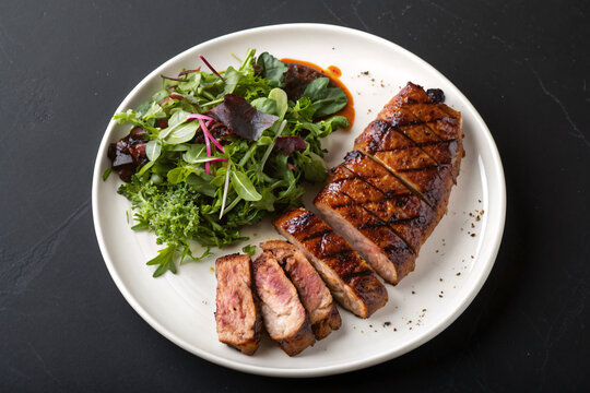 Gourmet grilled duck breast with fresh salad offers a healthy, delicious meal idea for upscale restaurant menus or culinary projects