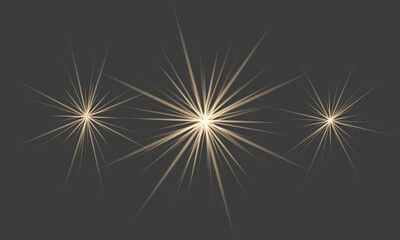 Fototapeta premium Golden starbursts and sparkling light effects on a dark black background texture