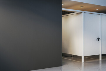 Blank dark wall near modern restroom entrance in clean interior space, ideal for signage, logo, or poster design mockup concept template. 3D Rendering