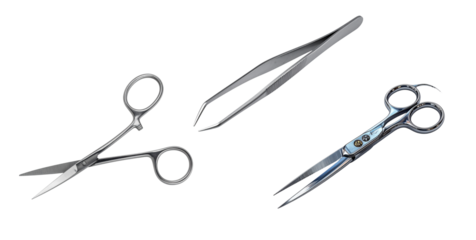 precision surgical instruments including scissors and tweezers displayed against a dark background for medical professionals and educational resources use