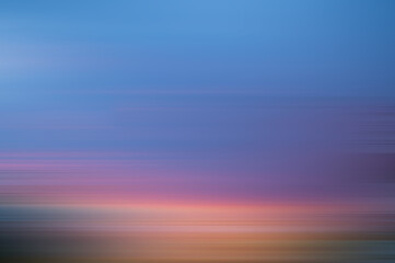 Blur motion background, blue purple orange gradient. Magenta sunset background motion blur