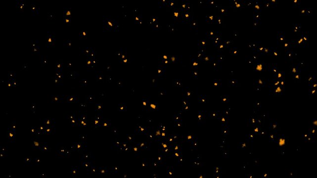 Dusty glowing hot fire particle with fire embers and sparks flying, abstract bokeh of dust particles floating on black background, slow motion particles and seamless looping 4K footage.