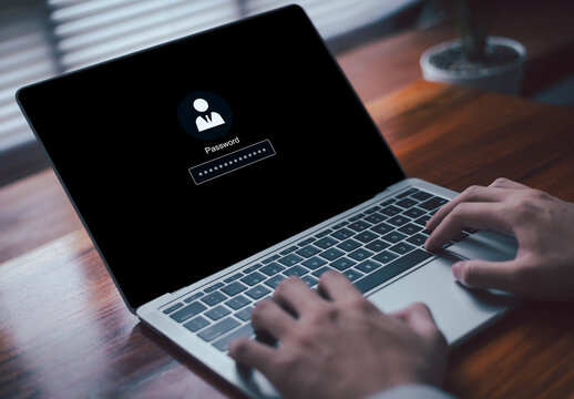 user entering a secure password on a laptop login screen, representing cybersecurity, data protection, user authentication, privacy, and safe digital access in a modern technology environment.