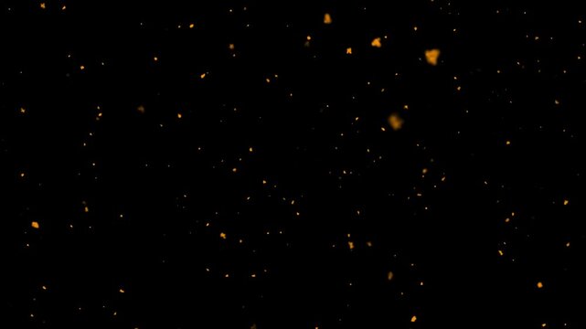 Shimmering dust particles fly in the air with fire embers and sparks on black background, abstract bokeh dust floating slow motion, surreal ember fire dust rising up, 4K loop overlay.