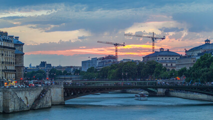 Le Pont D'Arcole bridge at sunset with boats timelapse, Paris, France, Europe