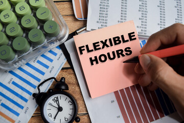 Concept of flexible hours write on sticky notes isolated on Wooden Table.