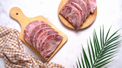 Raw Wagyu Beef Chops on Cutting Boards with Garnish