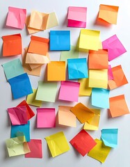 Colorful sticky notes scattered on a white surface (6)