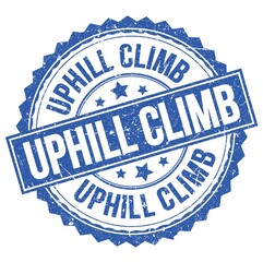 Fototapeta premium UPHILL CLIMB text on blue round stamp sign
