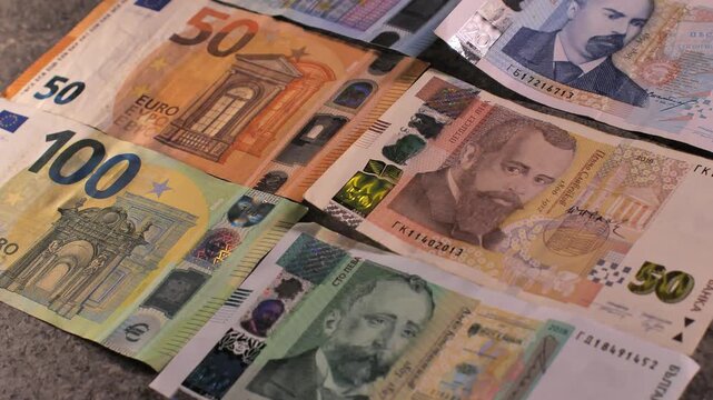 Bulgaria change currency, Bulgaria Lev to Euro. Money exchange. Paper banknotes on table. Concept, economy, competition, crisis, banking and finance. BGN,BGL. Scene H. Close up slide shot.