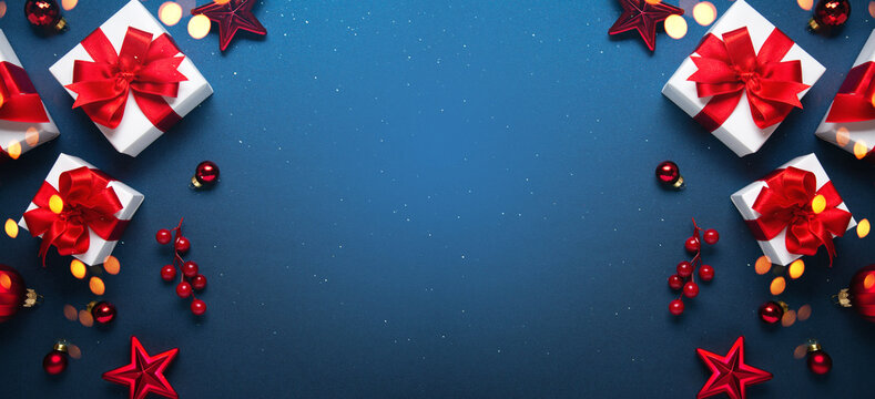 Merry Christmas and Happy Holidays greeting card, frame, banner. New Year. Noel. Red and white Christmas decorations and gifts on blue background top view. Winter xmas holiday celebration theme. - Powered by Adobe