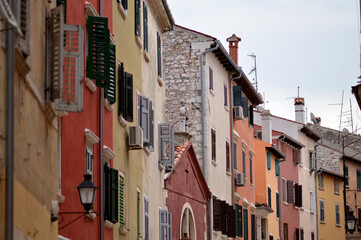 windows in old town of Rovinj with colorful wooden blinds