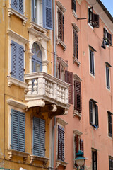 windows in old town of Rovinj with colorful wooden blinds