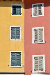 windows in old town of Rovinj with colorful wooden blinds