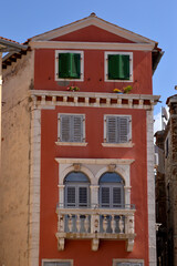 windows in old town of Rovinj with colorful wooden blinds