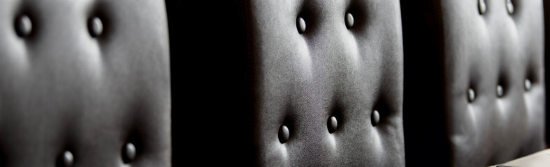 A brown leather sofa in a restaurant interior