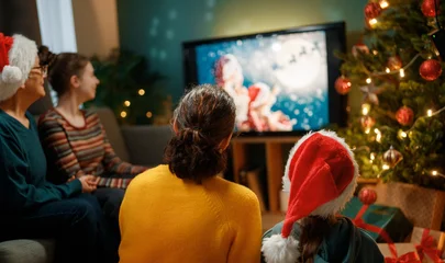 Fototapeten Pony family watching holiday movies at home  © Konstantin Yuganov