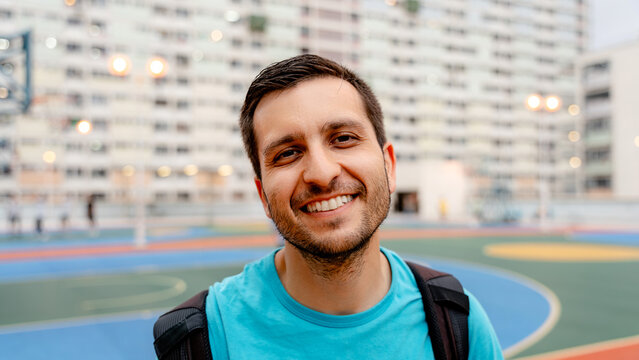 Man at colorful basketball court in Choi Hung estate