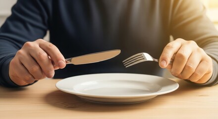 Empty plate anticipates meal on dining table, showing anticipation of food. Empty plate, with cutlery in hands, evokes feelings of hunger. Illustrating concept of food scarcity,