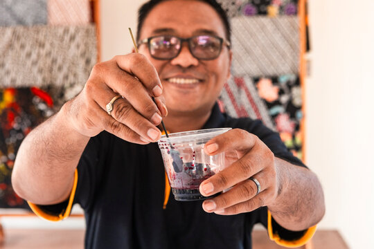 Artisan crafting batik with traditional techniques