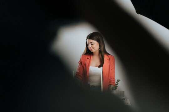 Serene woman in studio setting captured behind the scenes
