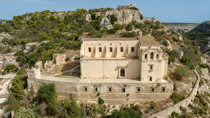 Fototapeta premium Aerial view of the Church of San Matteo, located in Scicli, a city in the province of Ragusa, Sicily, Italy. This church is a symbol of Sicilian Baroque and dominates the city from above.