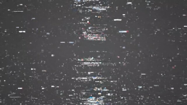 Abstract digital static and pixelated noise on screen, symbolizing corrupted video data or interference - Powered by Adobe