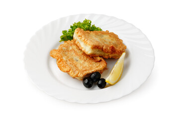 Delicious golden fried fish fillets served with fresh greens and lemon wedge