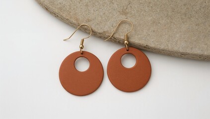 Terracotta clay ring providing earthy handmade texture on plain white background, jewelry, fashion, design, color, style, portrait, picture, industrial, gold, silver, symbol, wedding, steel, stone