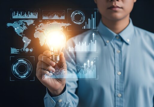 Person holding a lightbulb with digital interface displaying world map and financial charts overlayed 96