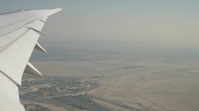day time abu dhabi area landscape traffic road aircraft window passenger view panorama 4k uae