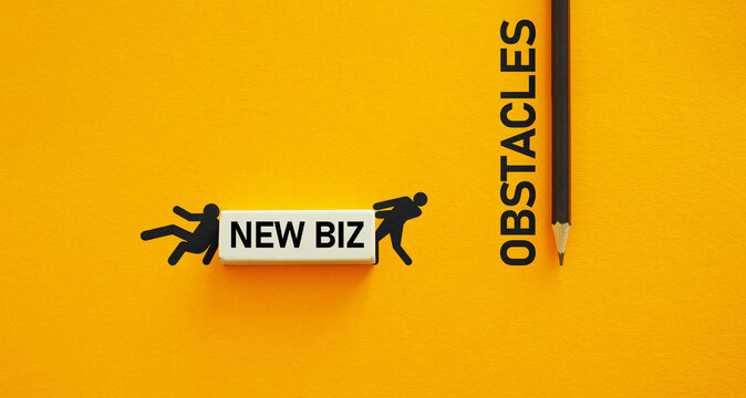 Businessmen pushing giant eraser with New Biz label showing challenging and rewarding journey of new startup and overcome obstacles