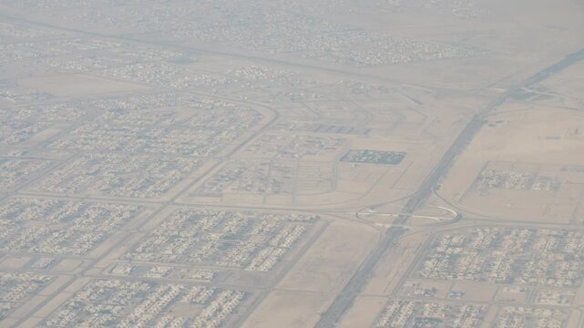 day time abu dhabi district residential area landscape traffic road aircraft window passenger view panorama 4k uae
