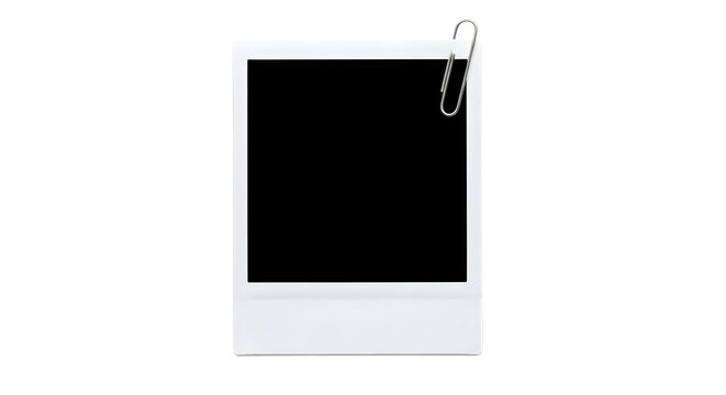 White instant photo frame with silver paper clip attached to the top right corner isolated on a transparent background
