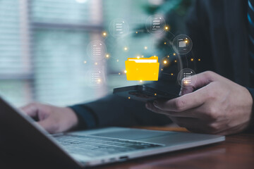 Digital file transfer between smartphone and laptop, representing data management, cloud document...