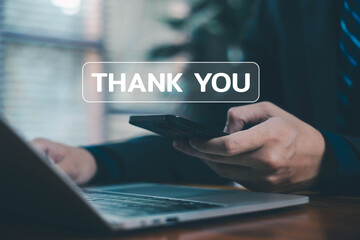 A businessperson interacting with a digital thank you message on a laptop, representing appreciation, gratitude, positive communication, customer relationships, and professional acknowledgment.