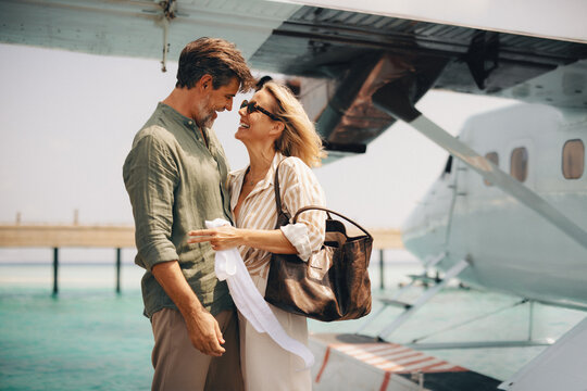 Romantic moment between mature couple on luxury tropical getaway