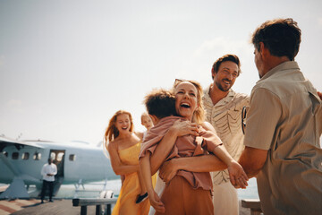 Family reunion at tropical resort as relatives arrive by seaplane