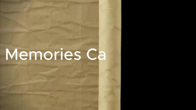 Close up of a beige textured surface with the word mem visible on the left side of the frame