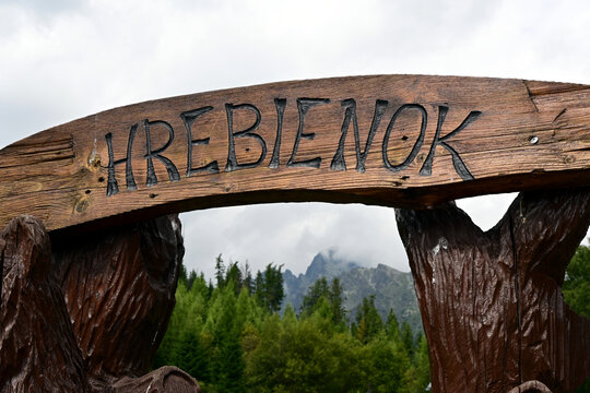 A closeup of craved wooden bears and Hrebienok sign at Vysoke Tatry, Hrebienok, High Tatras, Slovakia