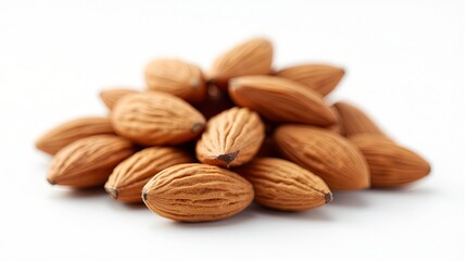 Close up shot of brown almond heap nuts on white background. Healthy tasty vegan food snack ingredient.