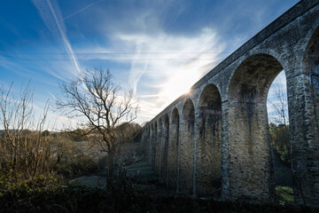 The impressive victorian built Thornton viaduct backlit in autumn sunshine on a crisp clear day.