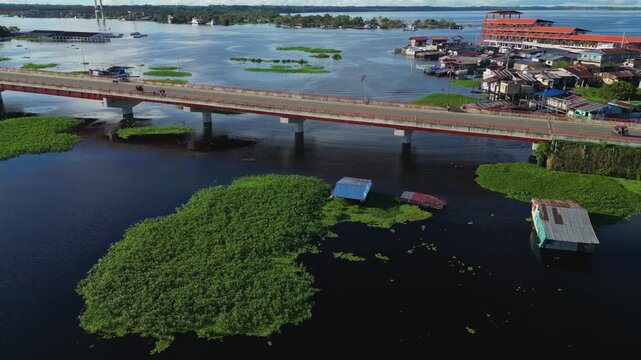 Drone footage of the bridge over the Nanay River in Iquitos, a river in the Amazon rainforest located in Loreto, Peru.