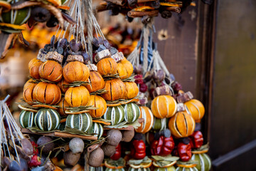 Christmas decoration with ornaments lights fir branches golden baubles red ribbons and festive details creating holiday atmosphere indoor seasonal design bright colorful winter celebration style scene